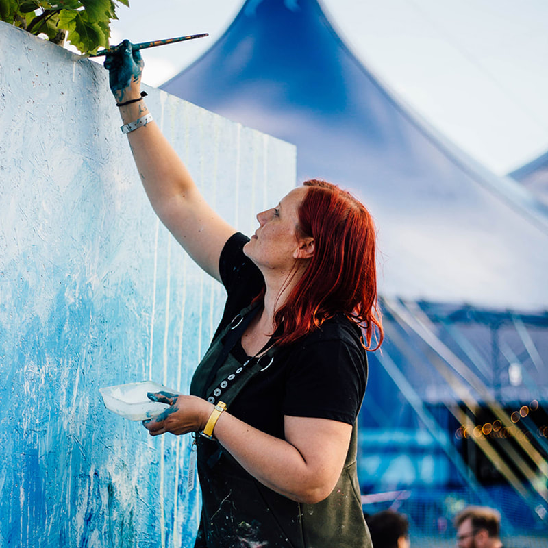 Kate Green painting at a festival